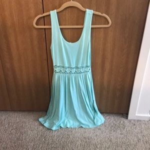 Teal dress w/ skin showing floral pattern midriff